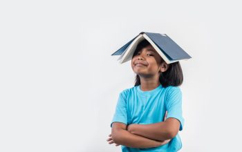 little-girl-reading-book-studio-shot (1)